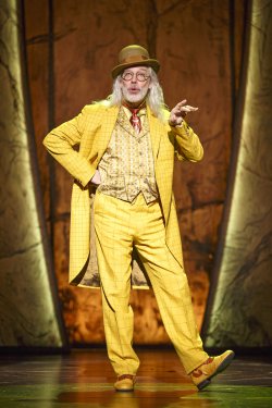 Terrence Mann as The Man in the Yellow Suit in a scene from “Tuck Everlasting” (Photo credit: Joan Marcus)