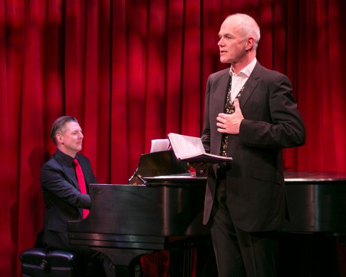 David Shrubsole (on piano) and Simon Green in a scene from “Life is for Living: Conversations with Coward” (Photo credit: Heidi Bohenkamp)